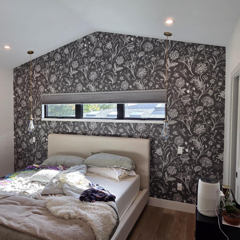 Modern living room with wallpapered feature wall